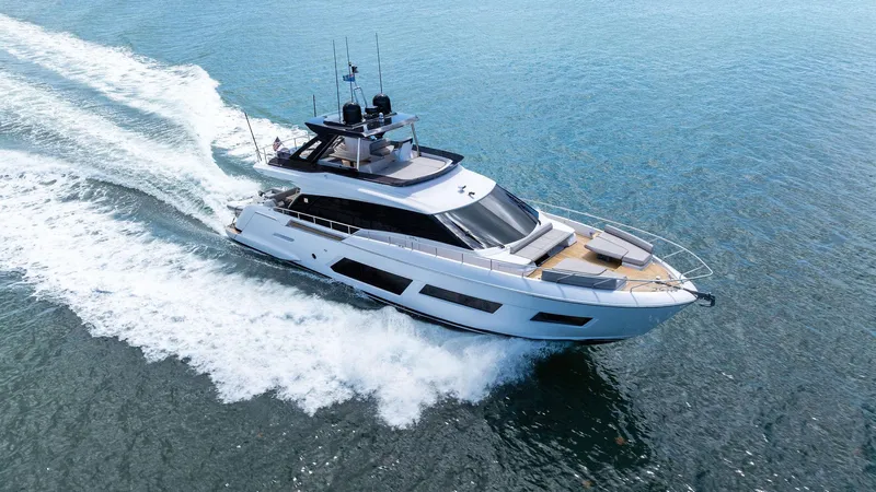 Giulia Yacht Photos Pics 2023 Ferretti Yachts 670 cruising on open water, showcasing sleek design and luxury features.
