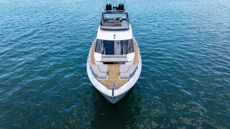 Giulia Yacht Photos Pics 2023 Ferretti Yachts 670 on calm blue water, showcasing sleek design and luxury features.
