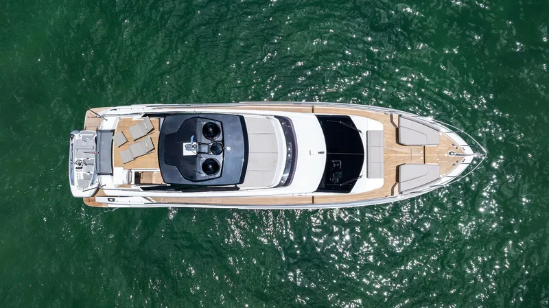 Giulia Yacht Photos Pics Aerial view of 2023 Ferretti Yachts 670 on green water.