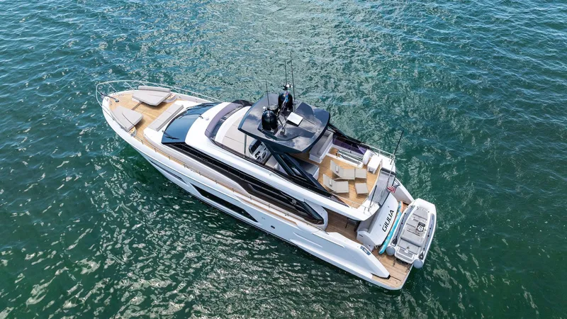 Giulia Yacht Photos Pics 2023 Ferretti Yachts 670 luxury yacht cruising on open water.