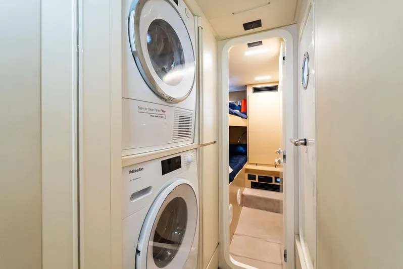 Giulia Yacht Photos Pics Laundry area with washer and dryer in 2023 Ferretti Yachts 670 interior.