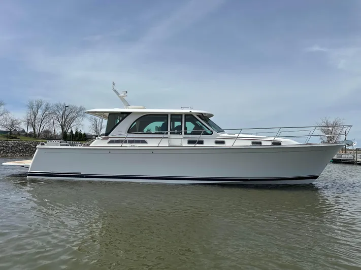  Yacht Photos Pics 2025 Sabre 45 Salon Express yacht on calm water, side view.