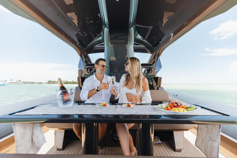 Anvera 48 Yacht Photos Pics Couple enjoying a meal on Anvera 48 yacht, 2025 model, with ocean view.
