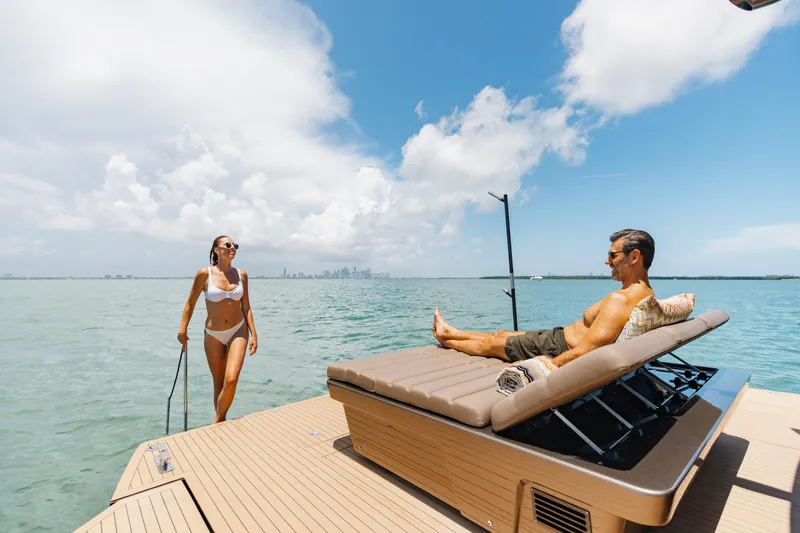 Anvera 48 Yacht Photos Pics Couple relaxing on Anvera 48 yacht, enjoying sunny day at sea, 2025 model.