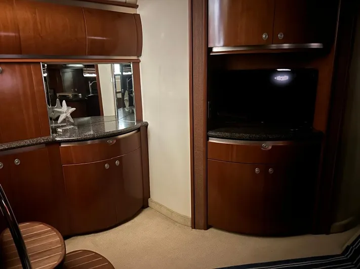  Yacht Photos Pics Luxurious interior of 2005 Sea Ray Sundancer 520 yacht with elegant wood cabinetry.