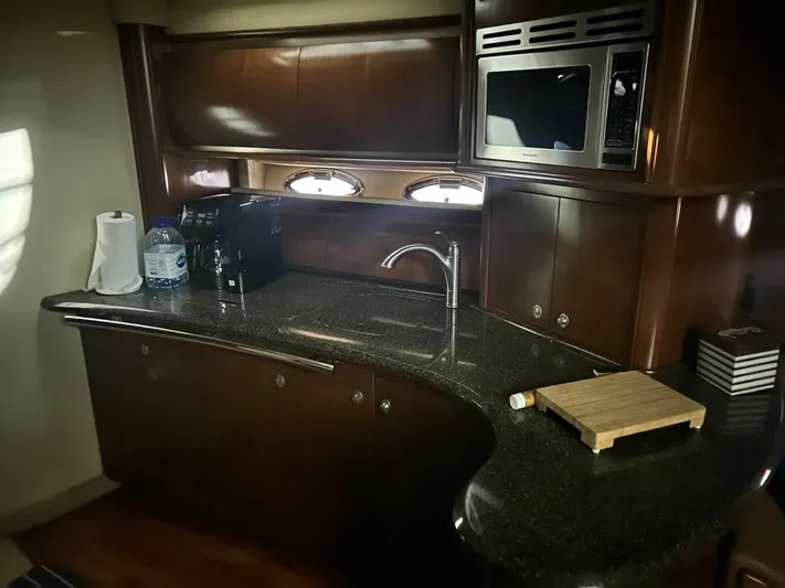  Yacht Photos Pics Luxurious kitchen area in 2005 Sea Ray Sundancer 520 yacht with modern amenities.