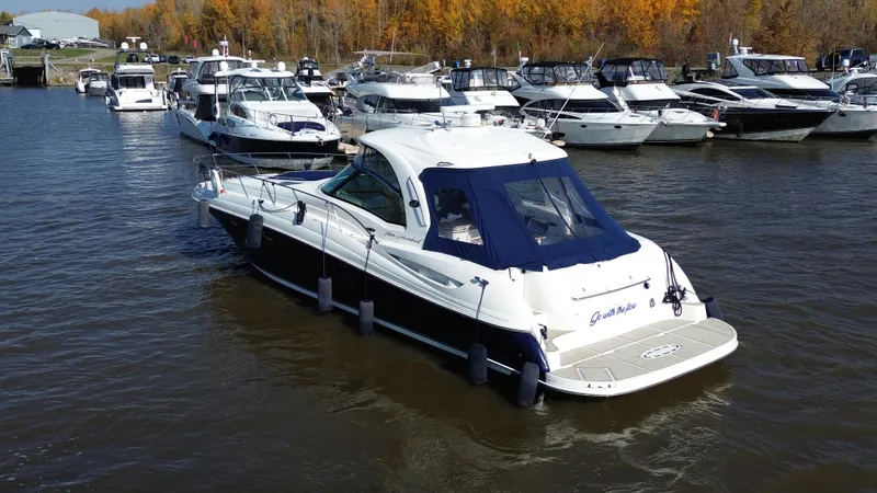  Yacht Photos Pics 2005 Sea Ray Sundancer 520 yacht docked in a marina with other boats.