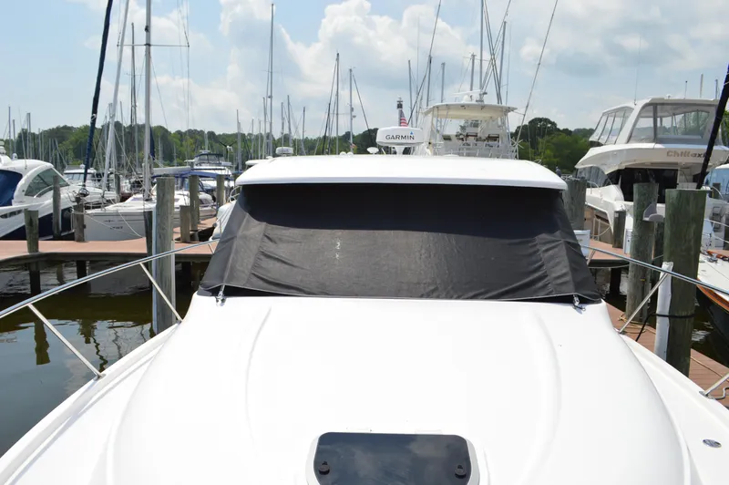  Yacht Photos Pics 2019 Tiara Yachts C39 Coupe docked at marina, front view with covered windshield.