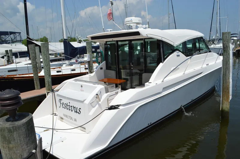  Yacht Photos Pics 2019 Tiara Yachts C39 Coupe docked, rear view, white exterior, marina setting.