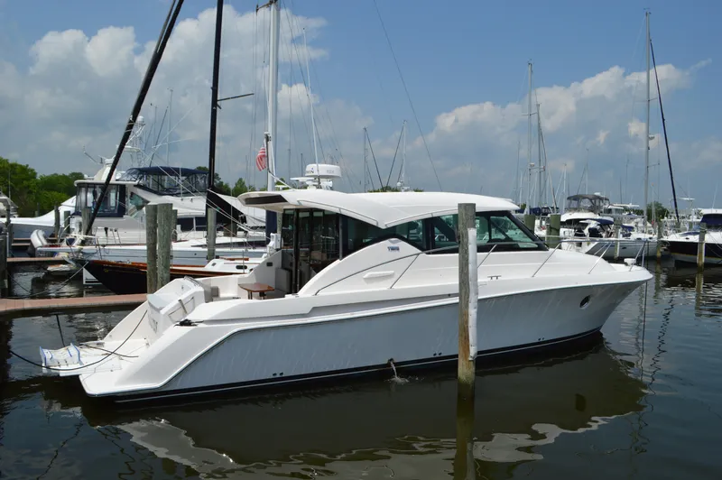  Yacht Photos Pics 2019 Tiara Yachts C39 Coupe docked at marina under blue sky.