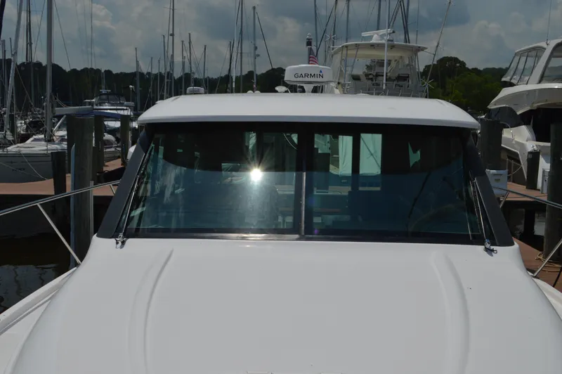 Yacht Photos Pics 2019 Tiara Yachts C39 Coupe docked at a marina, front view.