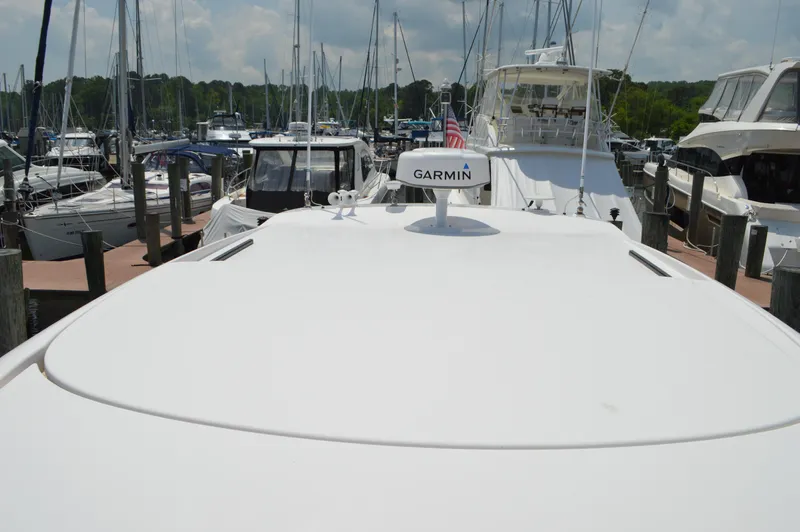  Yacht Photos Pics 2019 Tiara Yachts C39 Coupe docked, featuring Garmin equipment, surrounded by other boats.