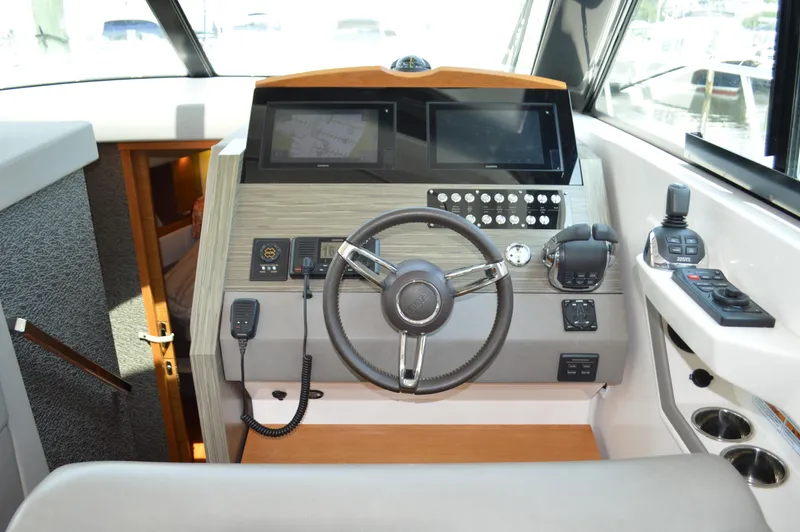  Yacht Photos Pics Helm of 2019 Tiara Yachts C39 Coupe with modern controls and navigation equipment.