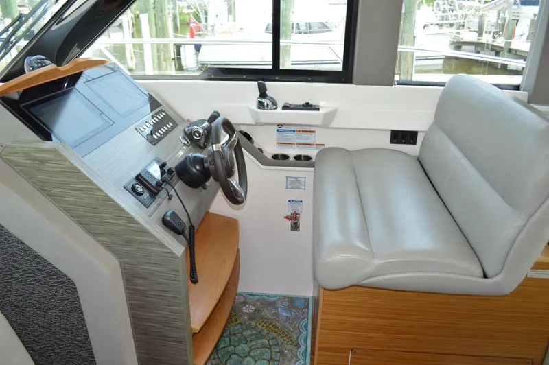  Yacht Photos Pics 2019 Tiara Yachts C39 Coupe helm with leather seat and modern controls.