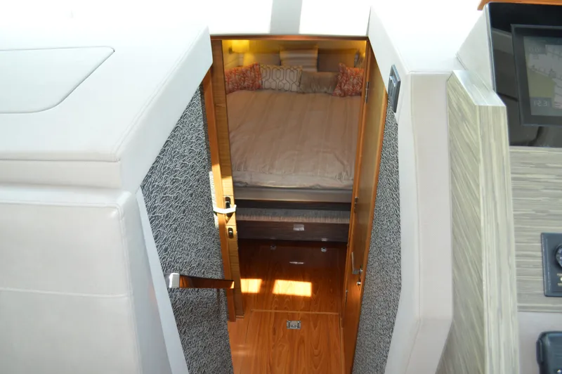  Yacht Photos Pics 2019 Tiara Yachts C39 Coupe cabin interior with bed and wooden flooring.