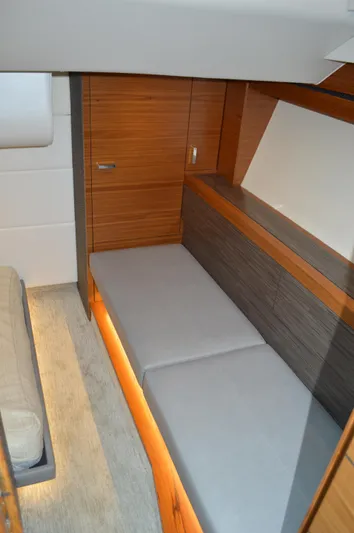  Yacht Photos Pics 2019 Tiara Yachts C39 Coupe interior cabin with modern wood finish and cozy seating.
