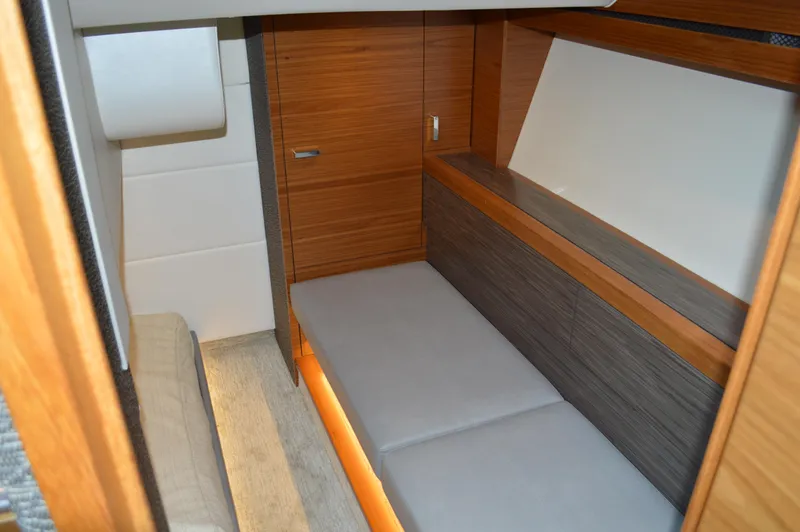  Yacht Photos Pics 2019 Tiara Yachts C39 Coupe interior cabin with modern wood finish and cozy seating.
