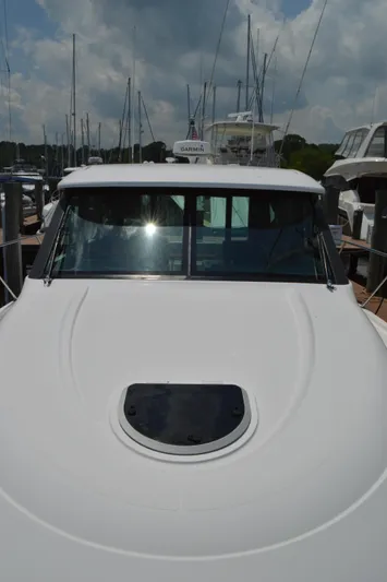  Yacht Photos Pics 2019 Tiara Yachts C39 Coupe docked, showcasing sleek design and modern features.