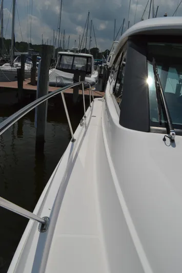  Yacht Photos Pics 2019 Tiara Yachts C39 Coupe docked, showcasing sleek design and modern features.