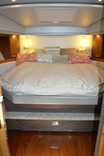 Yacht Photos Pics Luxurious bedroom interior of 2019 Tiara Yachts C39 Coupe with elegant bedding and ambient lighting.