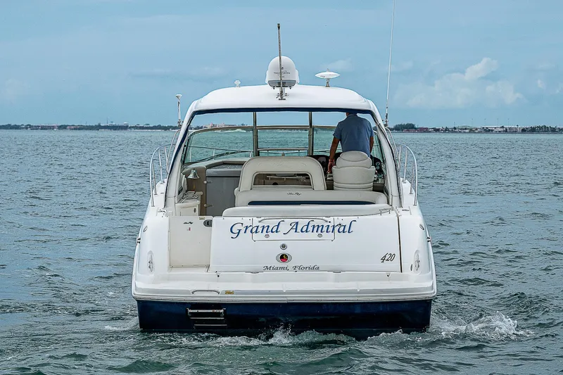 Grand Admiral Yacht Photos Pics 2004 Sea Ray 420 Sundancer yacht named "Grand Admiral" cruising on open water.