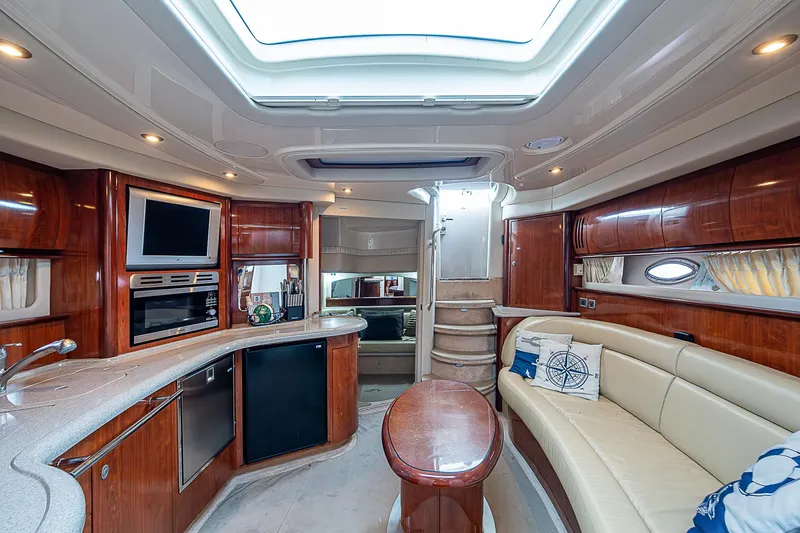 Grand Admiral Yacht Photos Pics Luxurious interior of 2004 Sea Ray 420 Sundancer yacht with elegant wood finishes.