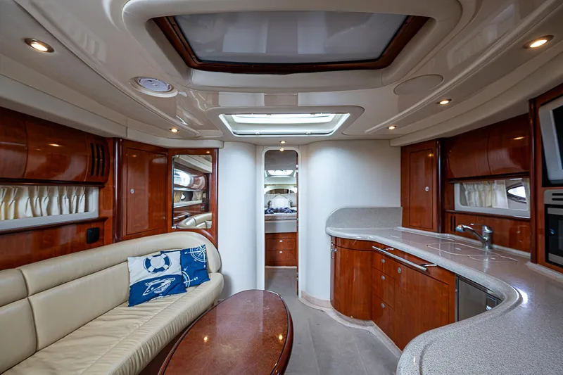 Grand Admiral Yacht Photos Pics Luxurious interior of 2004 Sea Ray 420 Sundancer yacht with elegant wood finishes.