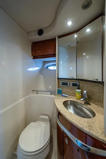 Grand Admiral Yacht Photos Pics Luxurious bathroom in 2004 Sea Ray 420 Sundancer yacht with modern fixtures.