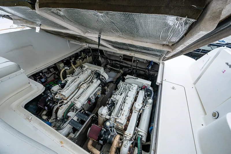 Grand Admiral Yacht Photos Pics Engine compartment of 2004 Sea Ray 420 Sundancer yacht, showcasing dual engines.