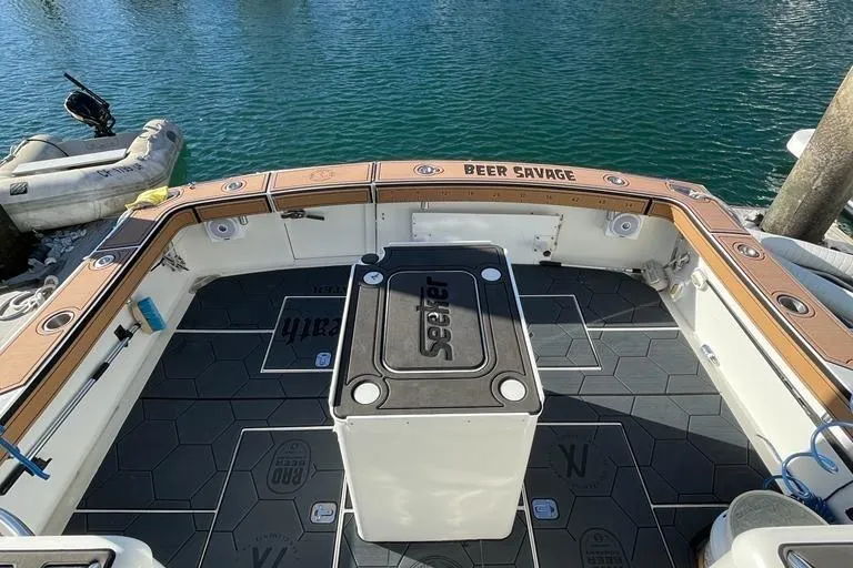 Beer Money Yacht Photos Pics 2004 Topaz 32 Express boat deck with fishing gear and custom flooring.