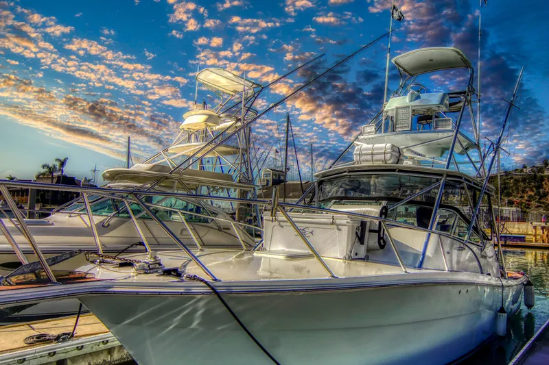 Beer Money Yacht Photos Pics 2004 Topaz 32 Express boat docked at marina under vibrant sunset sky.
