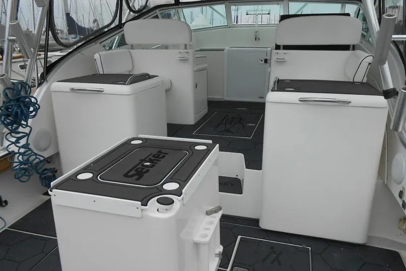 Beer Money Yacht Photos Pics 2004 Topaz 32 Express boat interior with seating and storage compartments.