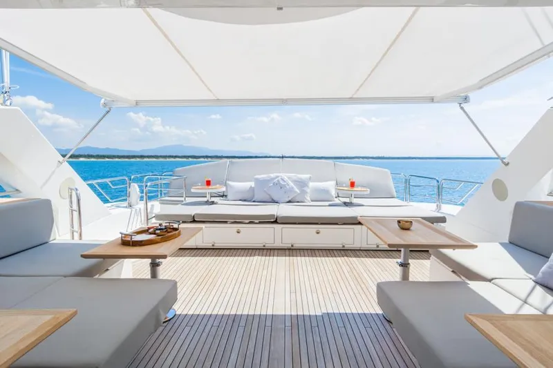  Yacht Photos Pics Luxurious Sunseeker 131 yacht deck with seating, tables, and ocean view, 2014 model.