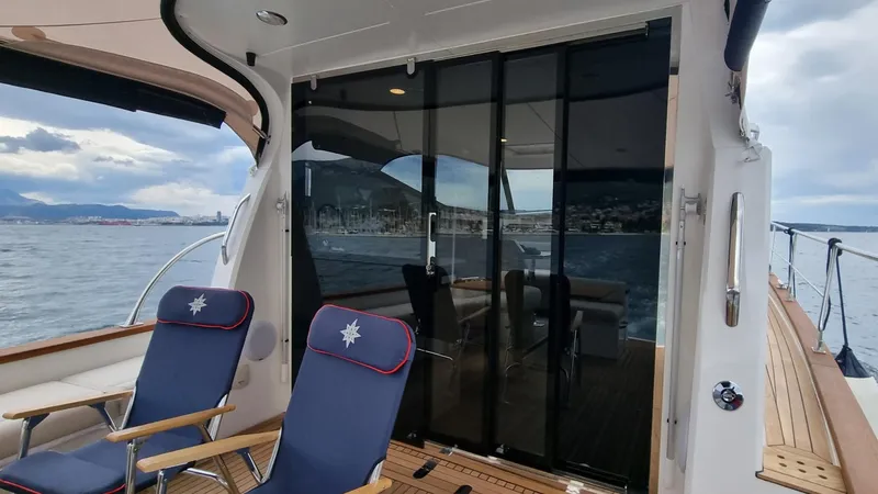 470 Rc Yacht Photos Pics Luxury Monachus 470 RC yacht deck with chairs, glass doors, and ocean view, 2026 model.