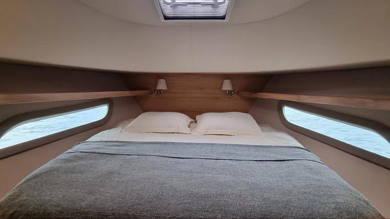 470 Rc Yacht Photos Pics Luxurious bedroom interior of 2026 Monachus 470 RC yacht with ocean view windows.