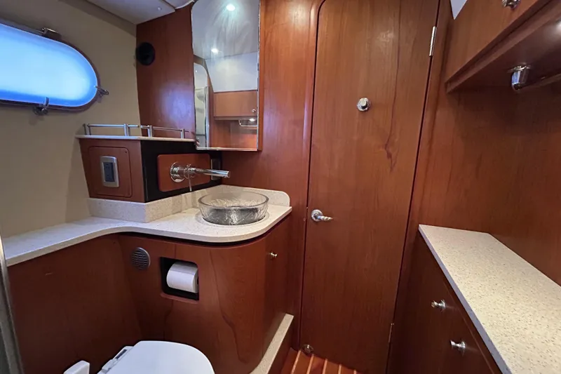  Yacht Photos Pics Luxurious 2008 Tiara Yachts 3900 Sovran bathroom with wood accents and modern fixtures.