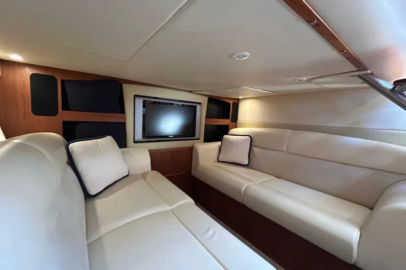  Yacht Photos Pics 2008 Tiara Yachts 3900 Sovran interior with plush seating and wall-mounted TV.