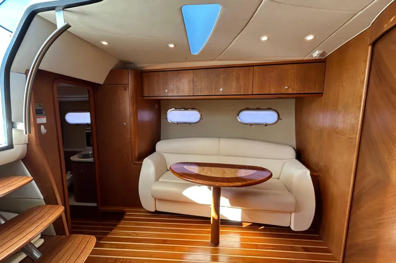  Yacht Photos Pics 2008 Tiara Yachts 3900 Sovran interior with wooden finishes and cozy seating area.