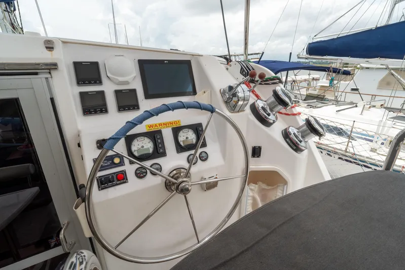 Papillon Yacht Photos Pics Helm of 2012 Leopard 39 catamaran with navigation instruments and steering wheel.