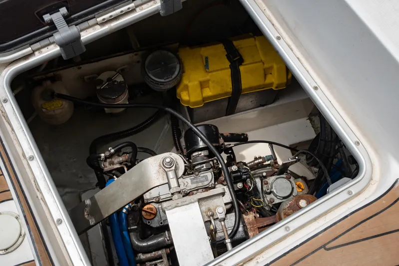 Papillon Yacht Photos Pics Engine compartment of a 2012 Leopard 39 yacht, featuring mechanical components and a yellow battery box.