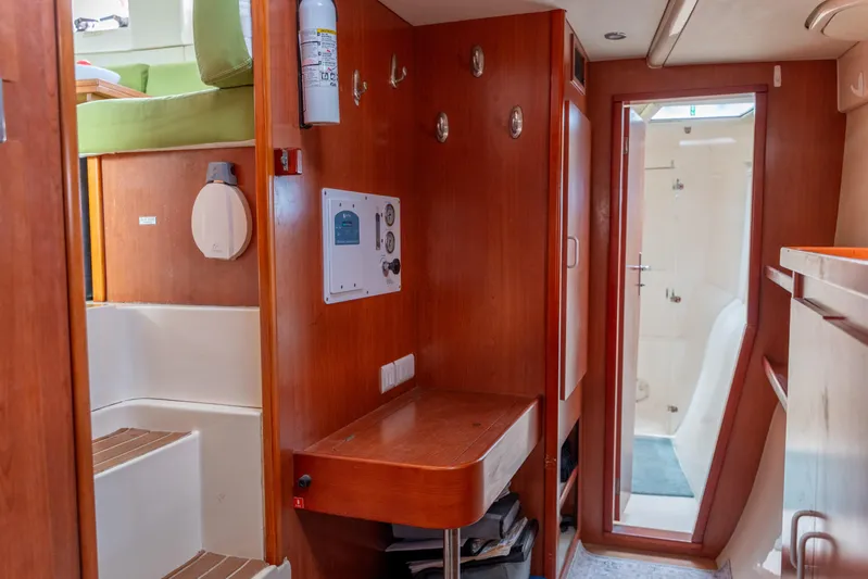 Papillon Yacht Photos Pics Interior of 2012 Leopard 39 yacht with wooden finishes and compact design.