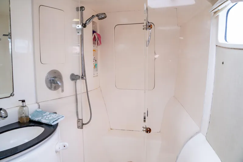 Papillon Yacht Photos Pics Bathroom interior of a 2012 Leopard 39 yacht, featuring a shower and sink.