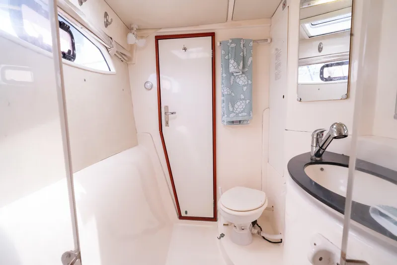 Papillon Yacht Photos Pics 2012 Leopard 39 yacht bathroom with modern fixtures and nautical decor.