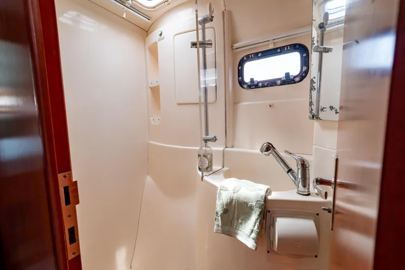 Papillon Yacht Photos Pics Bathroom interior of 2012 Leopard 39 yacht, featuring shower and sink.