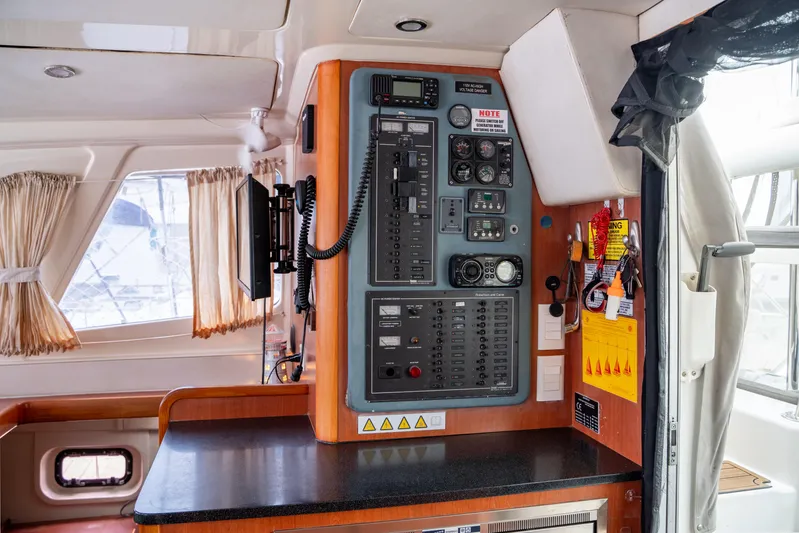 Papillon Yacht Photos Pics Control panel inside a 2012 Leopard 39 catamaran, featuring navigation and communication equipment.