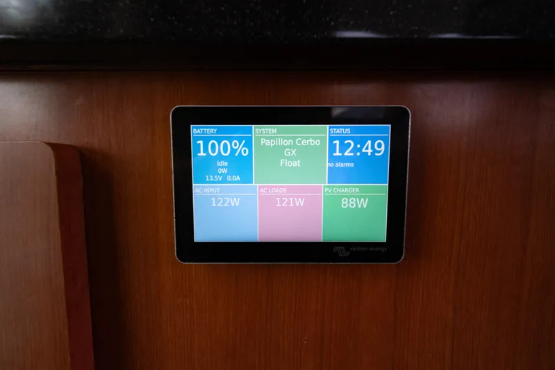 Papillon Yacht Photos Pics Digital control panel on Leopard 39 yacht, displaying battery status and system information.