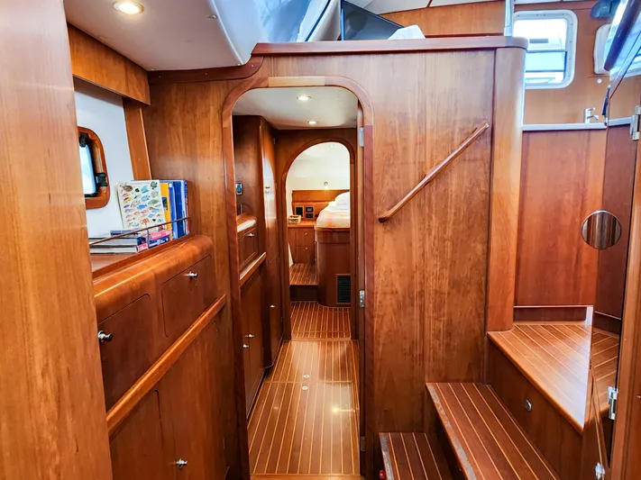 Frolic Yacht Photos Pics Luxurious wooden interior of 2014 Antares 44i yacht with cozy cabin and elegant design.