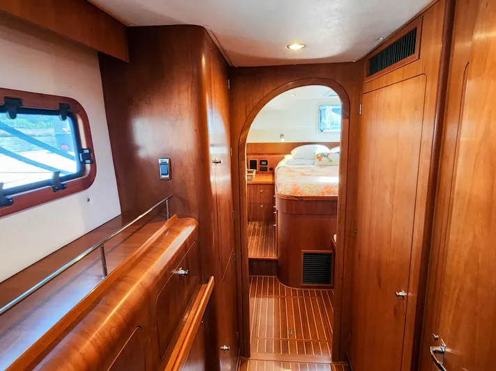 Frolic Yacht Photos Pics Luxurious wooden interior of 2014 Antares 44i yacht cabin with cozy bed.