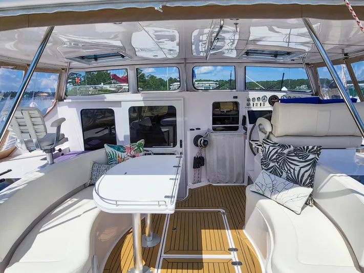 Frolic Yacht Photos Pics Luxurious 2014 Antares 44i yacht interior with elegant seating and modern navigation controls.