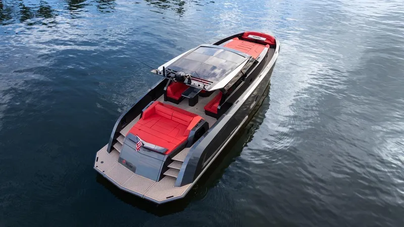 Moonshot Yacht Photos Pics 2023 Vanquish Yachts VQ58 luxury yacht with sleek design and red seating on water.